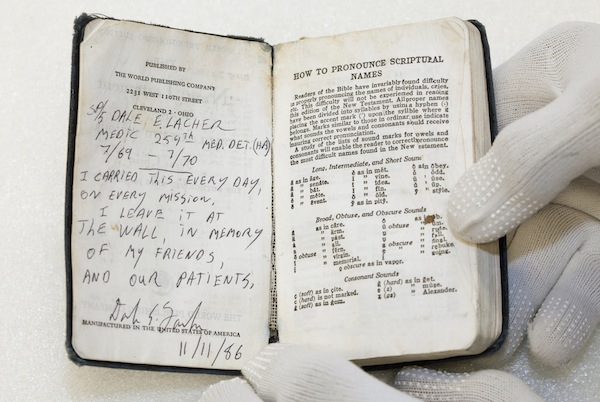 POCKET BIBLE INSCRIBED BY ARMY MEDIC PART OF COLLECTION OF ITEMS LEFT AT VIETNAM MEMORIAL