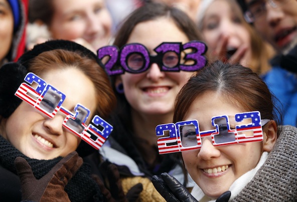 Akane Okamoto and Kurara Hayashi of Osaka, Japan, pose with Allison Hoff of North Dakota, center, on New Year's eve in New York's Times Square Dec. 31. (CNS photo/Gary Hershorn, Reuters)