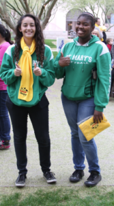 Denise Denogean and Rae Bell, juniors at St. Mary's High School show their support for school choice.