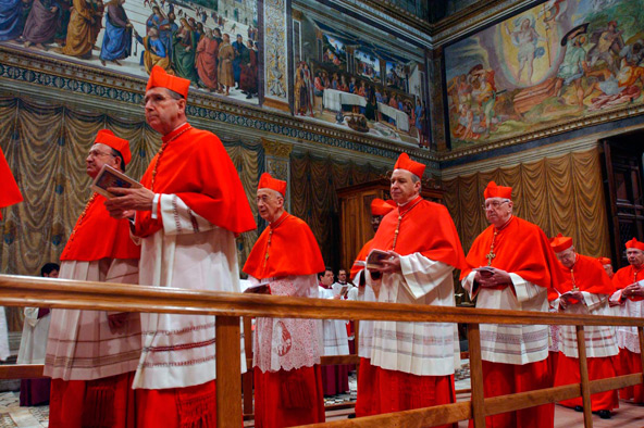 Cardinal Roger M. Mahony of Los Angeles, left, and other cardinals enter the Sistine Chapel at the beginning of the conclave at the Vatican in this April 18, 2005, file photo. (CNS photo/L'Osservatore Romano via Catholic Press Photo)