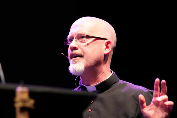 Fr. John Lankeit, rector of Ss. Simon and Jude Cathedral, encourages 2,100 men to attend confession monthly during the Feb. 8 Men's Conference at Grand Canyon University (J.D. Long-Garcia/CATHOLIC SUN)