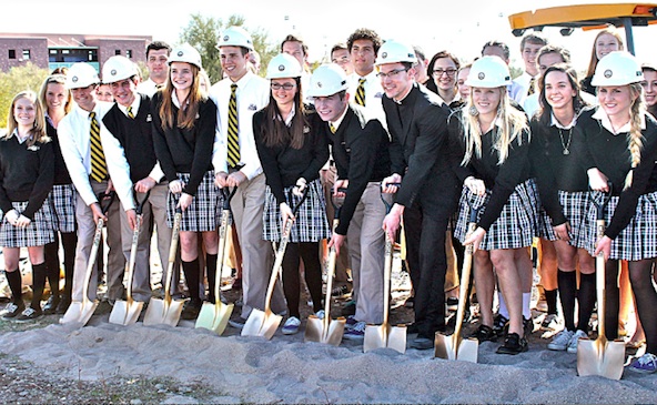 Notre Dame Preparatory students pose alongside Fr. John Parks, chaplain for a ceremonial groundbreaking Feb. 12. (courtesy photo)