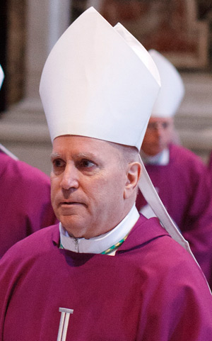 Denver Archbishop Samuel J. Aquila walks in procession with other bishops after concelebrating Mass in St. Peter's Basilica at the Vatican during his "ad limina" visit in this March 6, 2012 file photo. (CNS photo/Paul Haring)