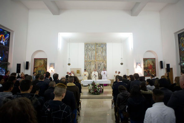 Pope Francis celebrates the Holy Thursday Mass of the Lord's Supper at Rome's Casal del Marmo prison for minors March 28. Pope Francis washed the feet of 12 young people of different nationalities and faiths, including at least two Muslims and two women, who are housed at the juvenile detention facility. (CNS photo/L'Osservatore Romano via Reuters)