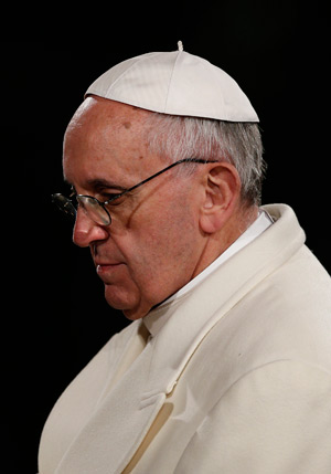 Pope Francis reaffirmed the importance of responding decisively to the problem of the sexual abuse of minors by members of the clergy and called on the Vatican office dealing with suspected cases to continue carrying out its mandate. He is seen leading t he Good Friday Way of the Cross at the Colosseum in Rome March 29. (CNS photo/Paul Haring)
