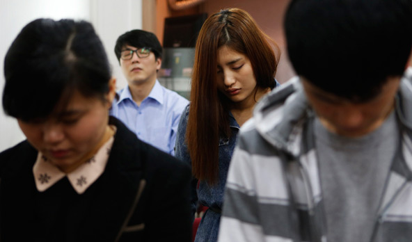 North Korean defectors living in Seoul pray for peace and reunification of the divided Korean Peninsula, during a church service in Seoul April 7. North Korea, angry about new U.N. sanctions imposed for its third nuclear weapon test in February, has mad e increasingly strident warnings of an imminent war with South Korea and the United States. (CNS photo/ Lee Jae-Won, Reuters)