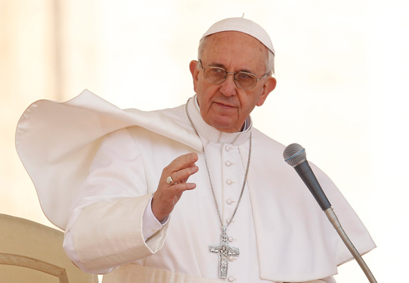 Pope Francis delivers his blessing during his general audience in St. Peter's Square at the Vatican April 10. (CNS photo/Paul Haring)