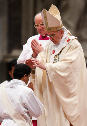 Pope Francis ordains one of 10 priests during a Mass in St. Peter's Basilica at the Vatican April 21. (CNS photo/Paul Haring)