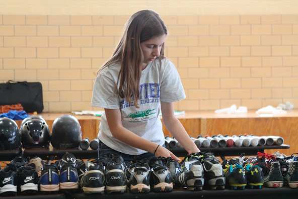 Caitlin White, a junior at Xavier College Preparatory, believes that all kids can play ball regardless of their family’s ability to afford equipment. (Ambria Hammel/CATHOLIC SUN)