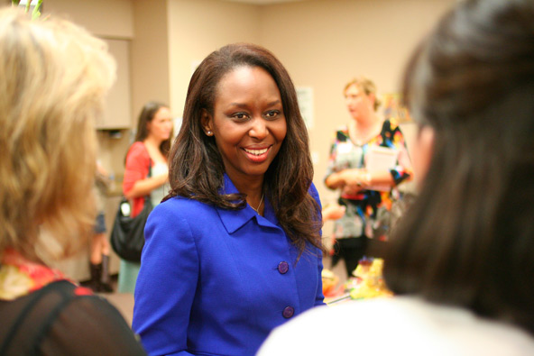 Immaculee Ilibagiza, who survived the 1994 genocide in Rwanada, signs books before addressing more than 1,200 attendees Oct. 29 at St. Andrew the Apostle Parish in Chandler. (J.D. Long-Garcia/CATHOLIC SUN)