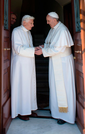 Retired Pope Benedict XVI greets Pope Francis at the Vatican May 2. The 86-year-old retired pontiff, who had been staying at the papal summer villa in Castel Gandolfo since retiring Feb. 28, returned to the Vatican to live in a monastery in the Vatican G ardens. (CNS photo/L'Ossevatore Romano via Reuters)