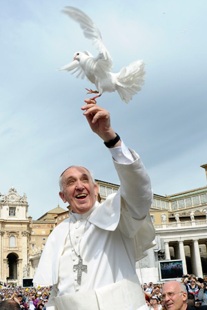 Pope Francis holds a dove before his weekly audience in St. Peter's Square at the Vatican May 15. (CNS photo/L'Osservatore Romano via Reuters)