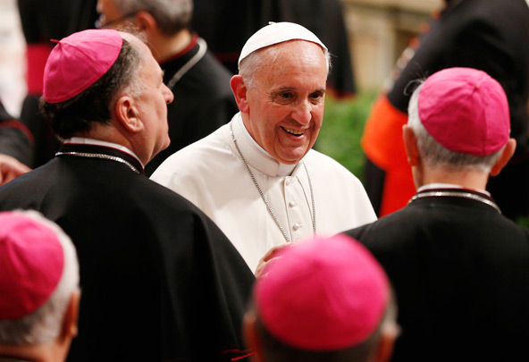 Pope Francis greets Italian bishops during a prayer service in St. Peter's Basilica at the Vatican May 23. More than 200 bishops reconfirmed their faith during the service. (CNS photo/Paul Haring)