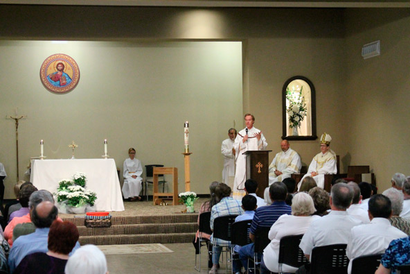 Fr. Billy Kosco, pastor of St. Henry in Buckeye, address parishioners May 11 after Bishop Thomas J. Olmsted blessed the new chapel and church hall.