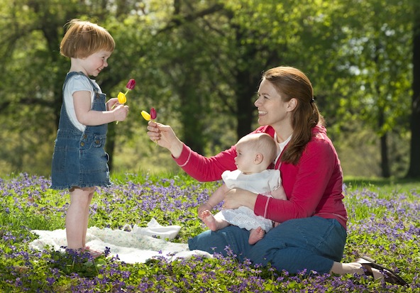 Bernadette Kleissler and her daughters Margaret, 3, and Elizabeth, 6 months, parishioners at St. Mary of Victories Church in St. Louis, enjoy a spring day at a park in St. Louis in this 2010 file photo. All mothers are honored in special ways on Mother's Day, which is May 12 this year. (CNS photo/Lisa A. Johnston)