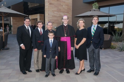 Auxiliary Bishop Eduardo A. Nevares and Bishop Thomas J. Olmsted pose for a photo with supporters of the Catholic Community Foundation.