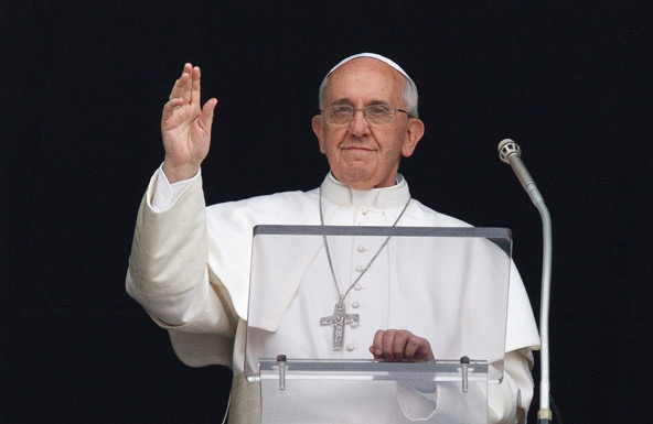 Pope Francis greets the crowd upon arriving to lead the Angelus from the window of his apartment overlooking St. Peter's Square at the Vatican June 9. (CNS photo/Paul Haring)