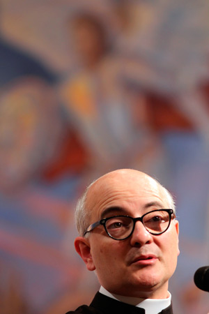 Fr. Fortea, pictured here in front of an image of St. Michael the Archangel, spoke to more than 1,000 at St. Timothy Parish in Mesa May 29. (J.D. Long-Garcia/CATHOLIC SUN)