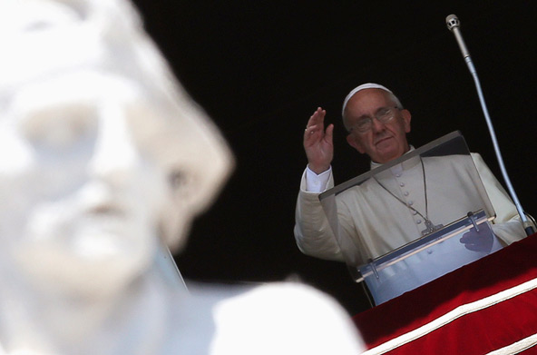 Pope Francis waves as he leads the Angelus from the window of his studio overlooking St. Peter's Square at the Vatican June 30. (CNS photo/Alessandro Bianchi, Reuters)