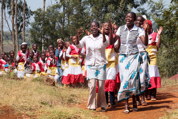 "The Second Vatican Council enabled the light of faith to illumine our human experience from within, accompanying the men and women of our time on their journey," says the encyclical "Lumen Fidei" ("The Light of Faith") from Pope Francis. Pictured is a procession of youths making its way to Sunday Mass at St. Joseph's Church in Mutungulu, Kenya. (CNS file photo/Nancy Phelan Wiechec)