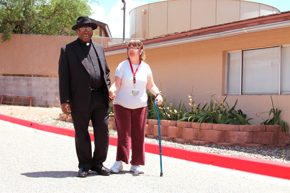 Fr. Alphonsus Bakyil, pastor of nearby St. Frances Cabrini, led the first of what he plans to make a monthly rosary for the 10 or so identified Catholics living at Rainbow Acres. (Ambria Hammel/CATHOLIC SUN)