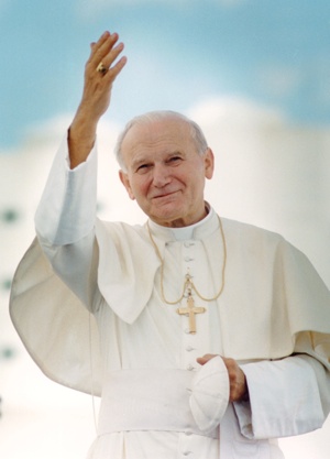 Blessed John Paul II will be declared a saint, the Vatican said July 5, after officials approved a second miracle attributed to his intercession. The Polish pontiff is pictured here arriving in Miami for the start of his 1987 trip to the United States. (CNS photo/Joe Rinkus Jr.)