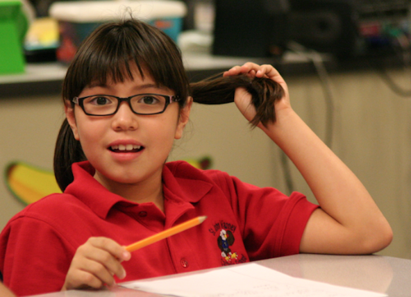 A St. John Vianney student sits at her desk during the first day of class in this 2011 file photo (Ambria Hammel/CATHOLIC SUN)