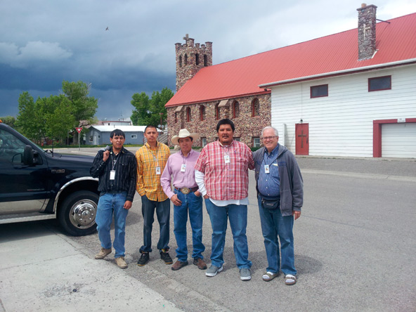 John Big Beaver, David Bear Child, John Irwin, Roger Kicking Woman, and Dr. Jim Asher in front of Little Flower Church in Browning, Mont.