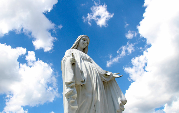 A statue of Mary overlooks the grounds of St. Jude Church in Mastic Beach, N.Y., Aug. 4. The feast of the Assumption of the Blessed Virgin Mary, Aug. 15, celebrates the belief that Mary was taken body and soul into heaven at the end of her life. (CNS pho to/Gregory A. Shemitz)
