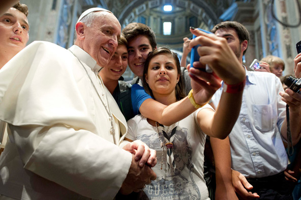 Pope Francis poses with youths during a meeting with young people from the northern Italian diocese of Piacenza-Bobbio in St. Peter's Basilica at the Vatican Aug. 28. (CNS photo/L'Osservatore Romano)