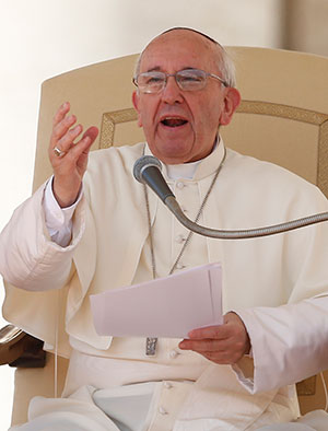 Pope Francis speaks during his general audience in St. Peter's Square at the Vatican Sept. 18. The pope renewed appeals for peace, saying the "human tragedy" in Syria can only be solved by dialogue and negotiations. (CNS photo/Paul Haring)
