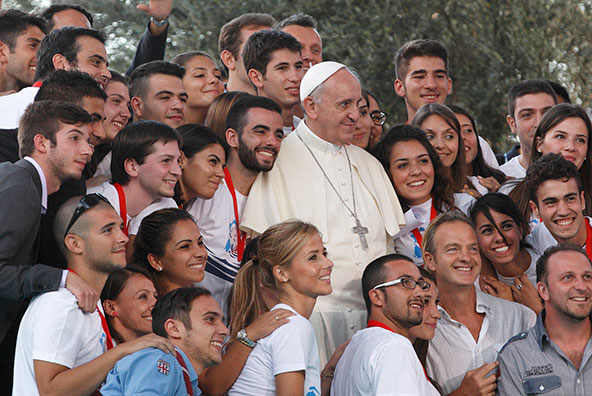 Pope Francis poses with young people during an encounter with youth in Cagliari, Sardinia, Sept. 22. (CNS photo/Paul Haring)