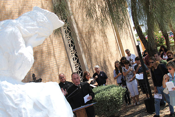 Fr. John Bonavitacola, pastor of Our Lady of Mount Carmel in Tempe, and Fr. John Coleman, pastor of St. Andrew Parish in Chandler, lead Catholics in praying for the unborn in front of a statue of Our Lady of Lasolette Sept. 14 in Tempe. (Ambria Hammel/CATHOLIC SUN)