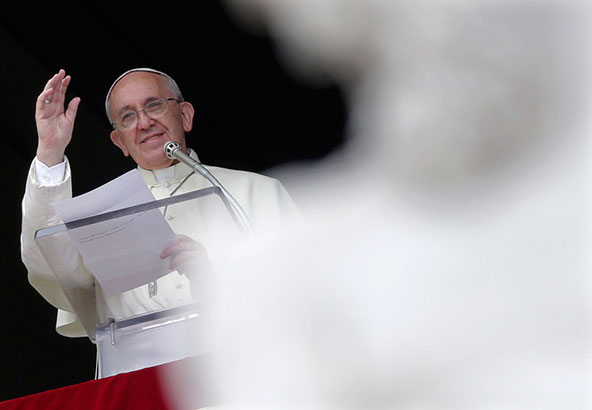 Pope Francis waves as he leads the Angelus from the window of his studio overlooking St. Peter's Square at the Vatican Oct. 7. (CNS photo/Max Rossi, Reuters)