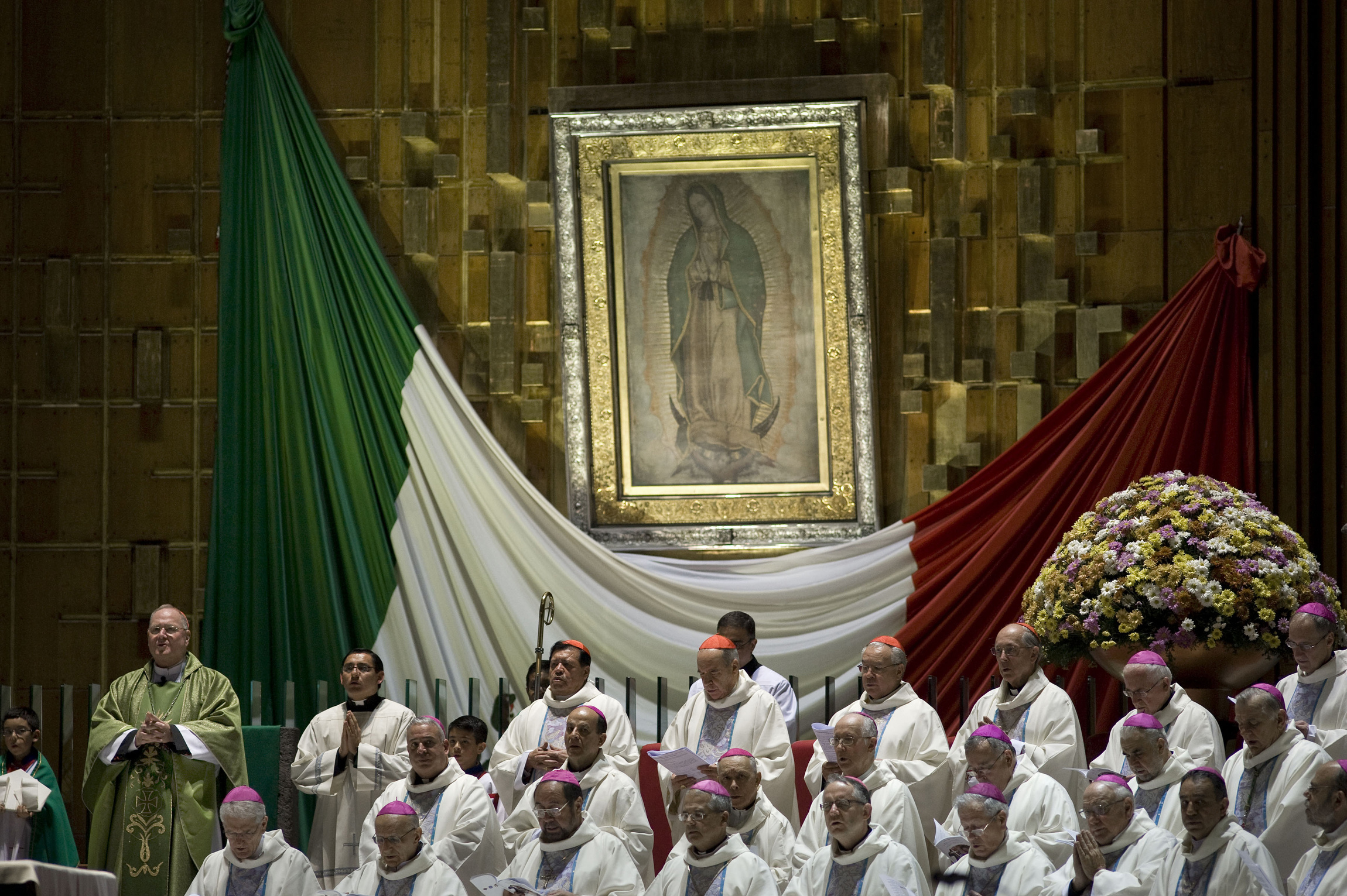 New York Cardinal Timothy M. Dolan, left, celebrates Mass alongside other prelates at the Basilica of Our Lady of Guadalupe in Mexico City Nov. 17. Bishops and church leaders from the Americas gathered Nov. 16-19 at the basilica to discuss the new evangelization in the Americas. (CNS photo/David Maung)