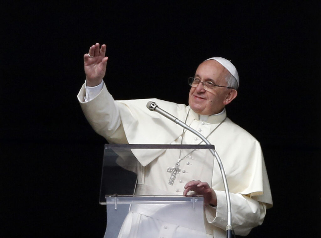 Pope Francis waves as he arrives to lead the Angelus from a window in the Apostolic palace at the Vatican Jan. 12. Following the Angelus prayer, the pope announced the names of 19 prelates who are to become cardinals Feb. 22. (CNS photo/Stefano Rellandini, Reuters)