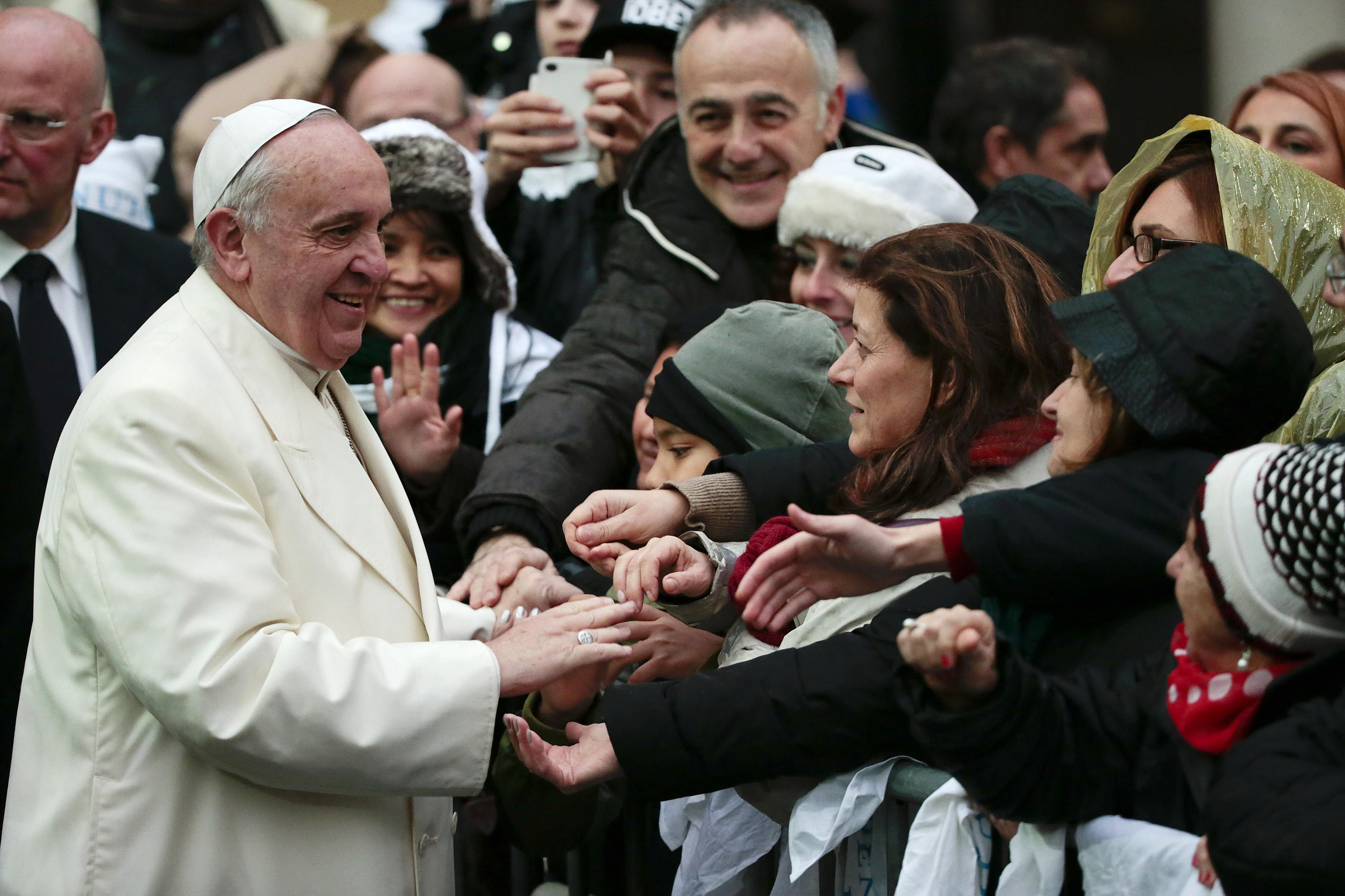 “Communication at the service of an authentic culture of encounter” is the title of Pope Francis’ message for the 48th World Day of Social Communications, which is celebrated on the Sunday before the feast of Pentecost (which falls on June 1, 2014). The message is dated Jan. 24, the memorial of St. Francis of Sales, patron saint of communicators. Pope Francis greets people as he arrives for a pastoral visit to the Basilica of the Sacred Heart of Jesus in Rome Jan. 19. (CNS photo/Tony Gentile, Reuters)