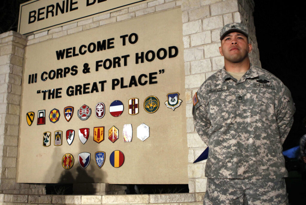 U.S. Army Sgt. 1st Class Erick Rodriguez stands guard at the entrance to Fort Hood Army Post in Texas before a news conference April 2. An Iraq War veteran who was being treated for mental health issues gunned down three colleagues at Fort Hood and injured 16 others before killing himself that day, authorities said. (CNS photo/Erich Schlegel, Reuters)