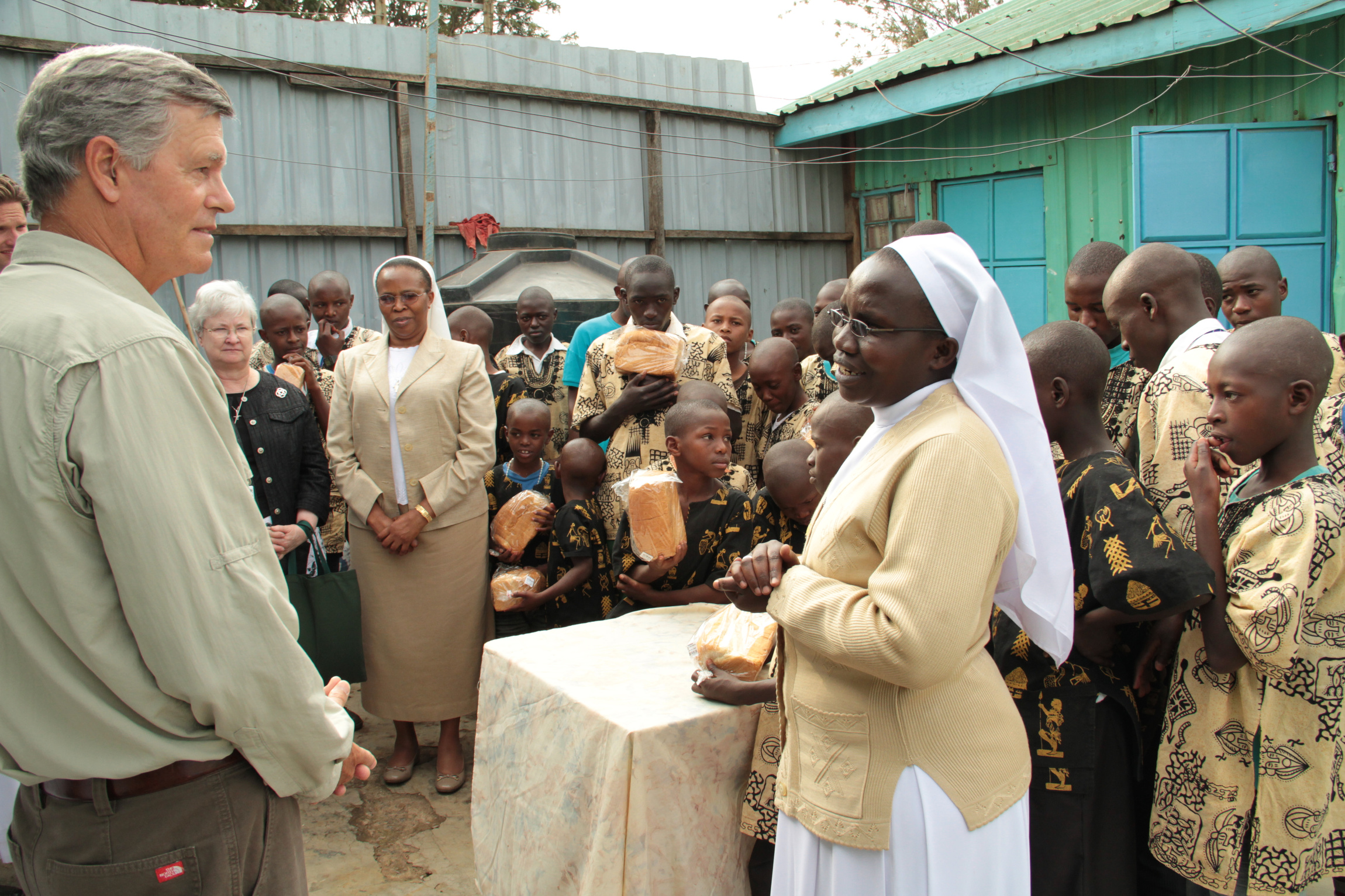 Steve Hilton, grandson of hotelier Conrad N. Hilton, talks with Sister Anisia Kitaka, a member of the Little Sisters of St. Francis of Assisi, during a 2012 visit to St. Francis Rehabilitation Center for Street Children in Nairobi, Kenya. Steve Hilton will soon retire as president and CEO of the foundation his grandfather established 70 years ago to support Catholic sisters all over the world. (CNS photo/courtesy Conrad N. Hilton Foundation)
