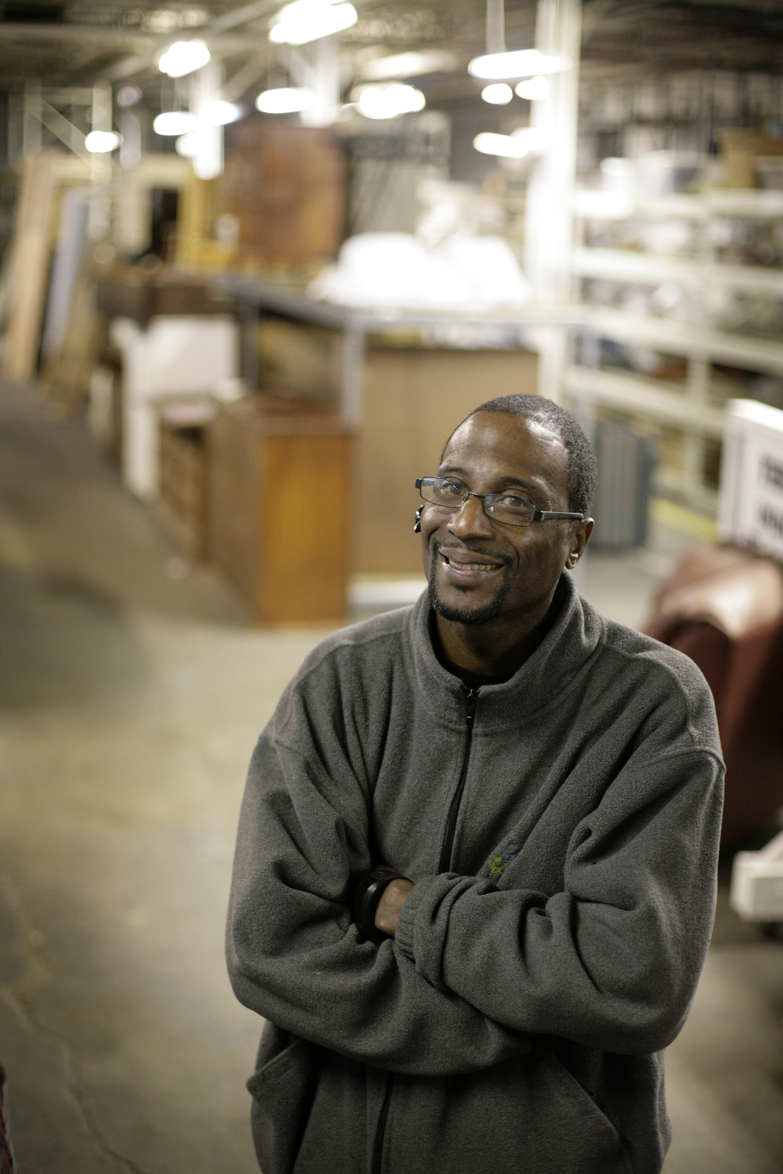 Michael Gordon, 41, warehouse and procurement manager for a furniture bank run by Caritas, an agency providing services to homeless people in Richmond, Va., poses for a photo Jan. 20. After time in prison on drug charges, Gordon now works to help alleviate poverty in Richmond's economically stressed Highland Park neighborhood. (CNS photo/Jay Paul)