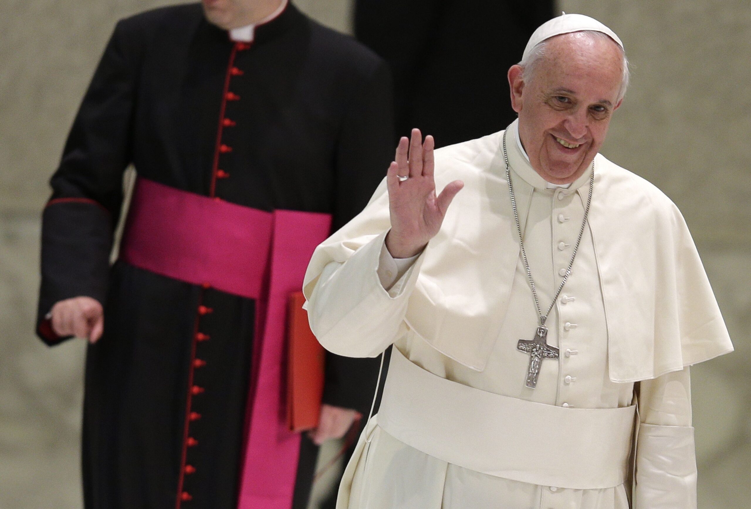Pope Francis waves as he arrives for a special audience with members of religious colleges in Paul VI hall at the Vatican May 12. (CNS photo/Max Rossi)