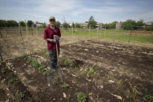 Terry Sawyer, 62, poses for a photo in the garden he tends at the U.S. Soldiers' and Airmen's Home in Washington. Sawyer spent two years in Vietnam as a U.S. Army medic, and said he received a medal for keeping a comrade alive by breathing for him for 45 minutes. For Sawyer and others, Memorial Day doesn't stand out for them, because they always remember fellow soldiers who died in battle. (CNS photo/Tyler Orsburn)
