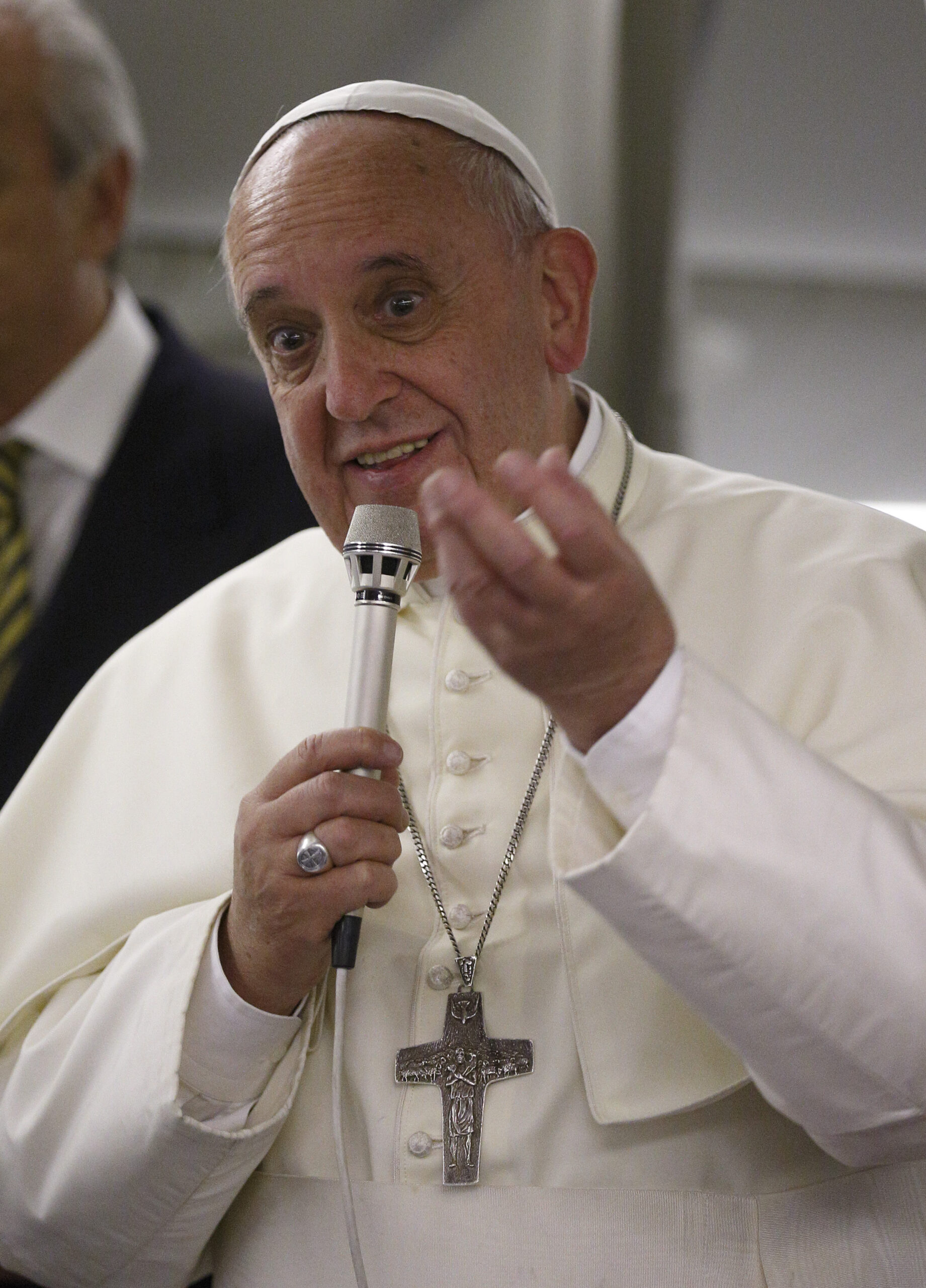 Pope Francis answers questions from journalists aboard the flight from Tel Aviv to Rome May 26. (CNS photo/Paul Haring)
