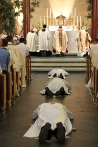 Moments before their ordination to the priesthood, the three men prostrated themselves on the floor of Ss. Simon and Jude Cathedral.