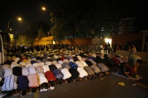 Demonstrators at the Israeli Embassy in Ankara, Turkey, pause for prayer during a protest July 18 against Israel's military action in Gaza. Pope Francis telephoned Israeli President Shimon Peres and Palestinian President Mahmoud Abbas July 18, urging all sides to end hostilities and build peace. (CNS photo/Umit Bektas, Reuters)