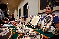 Native American artwork, including images of St. Kateri, are displayed for sale July 24 at the annual Tekakwitha Conference gathering in Fargo, N.D. The gathering of Native American Catholics, held July 23-27, marked its 75th anniversary. (CNS photo/Nancy Wiechec)
