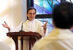 Maryknoll Father Larry Lewis delivers his homily in Chinese during a Mass for Chinese priests and nuns at the Cenacle Retreat Center in Ronkonkoma, N.Y., Aug. 20. The retreat was affiliated with Maryknoll's Chinese Seminary Teachers and Formators Project. (CNS photo/Gregory A. Shemitz)