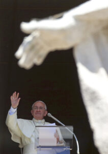 Pope Francis waves as he leads his Angelus from the window of his office in St. Peter's Square at the Vatican Sept. 7. (CNS photo/Alessandro Bianchi, Reuters)
