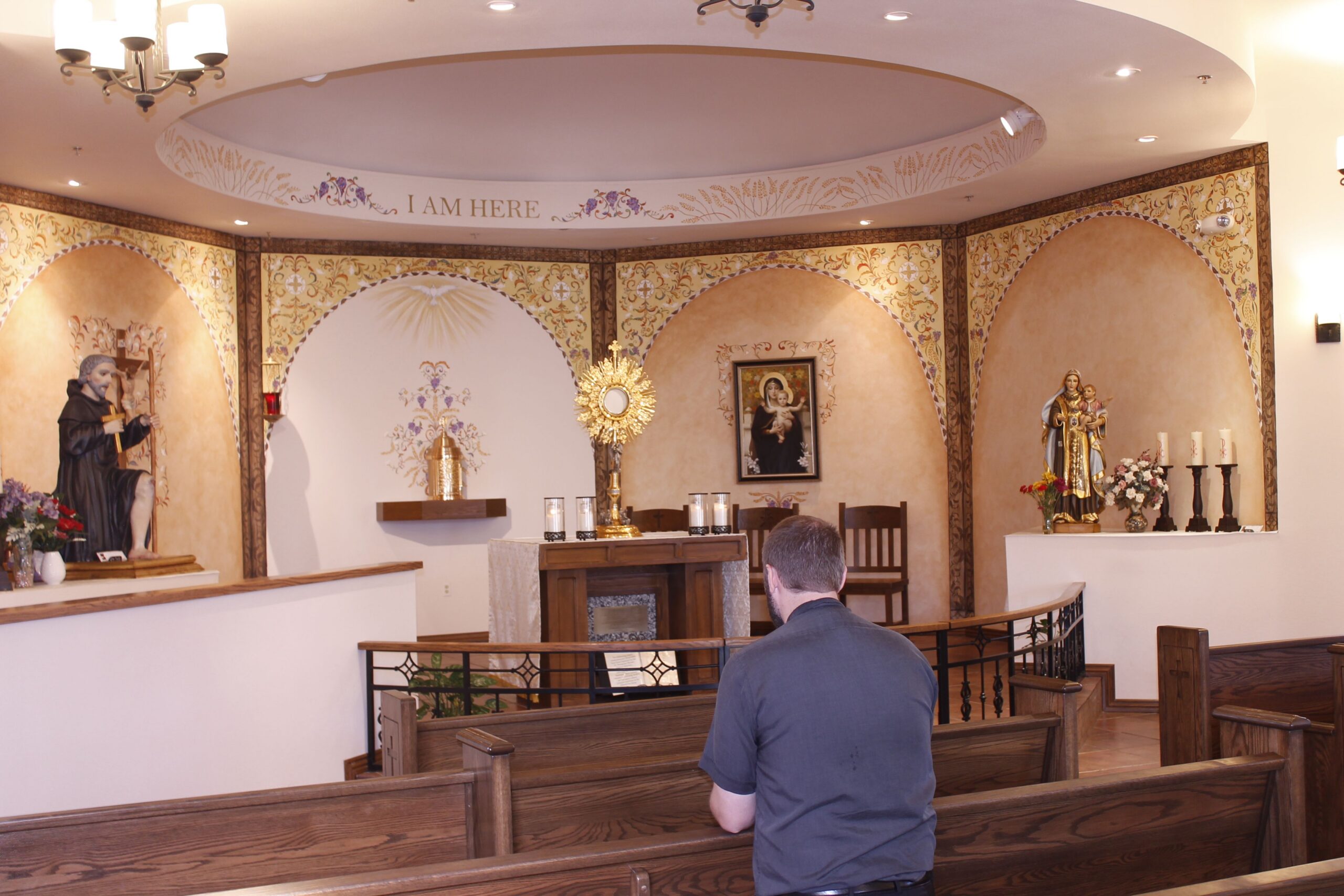 Fr. Matt Henry said praying before the St. Peregrine Shrine Oct. 3 called to mind the words of the Michael Poirier song, “Strength for the Journey.” He said time spent in prayer in the chapel dedicated to the patron saint of cancer sufferers has been a source of strength for him. (Joyce Coronel/Catholic Sun)