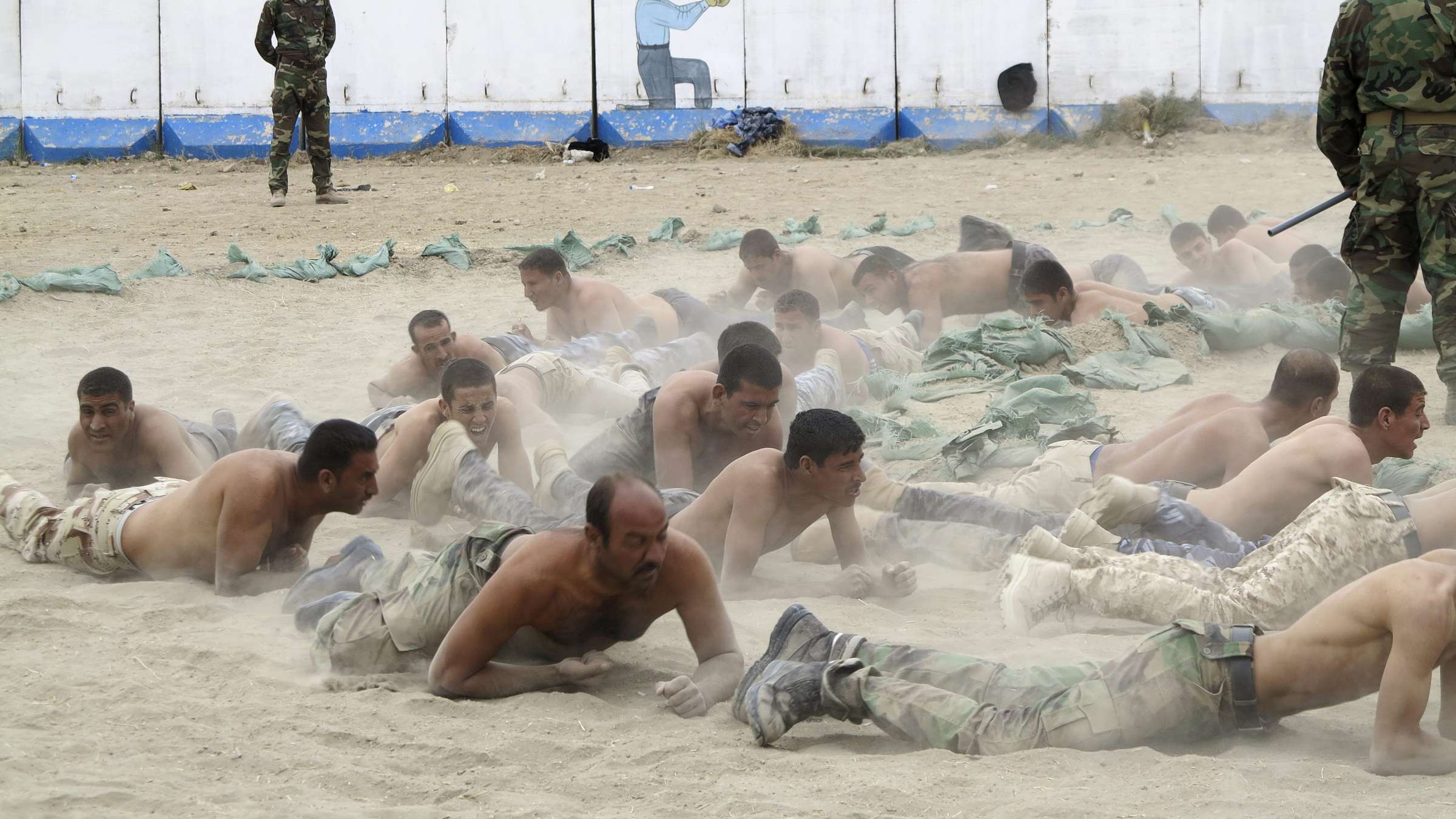 Tribal fighters take part in a military training near Baghdad Nov. 16 to prepare for fighting against Islamic State militants. Lebanon's Catholic leaders have called for peace in Syria and Iraq. (CNS photo/Reuters)